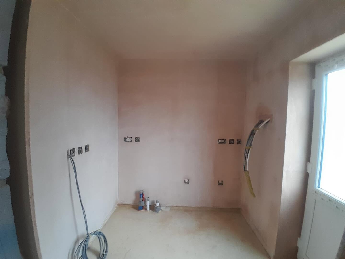 Kitchen walls and ceiling skimmed, ready for fitting