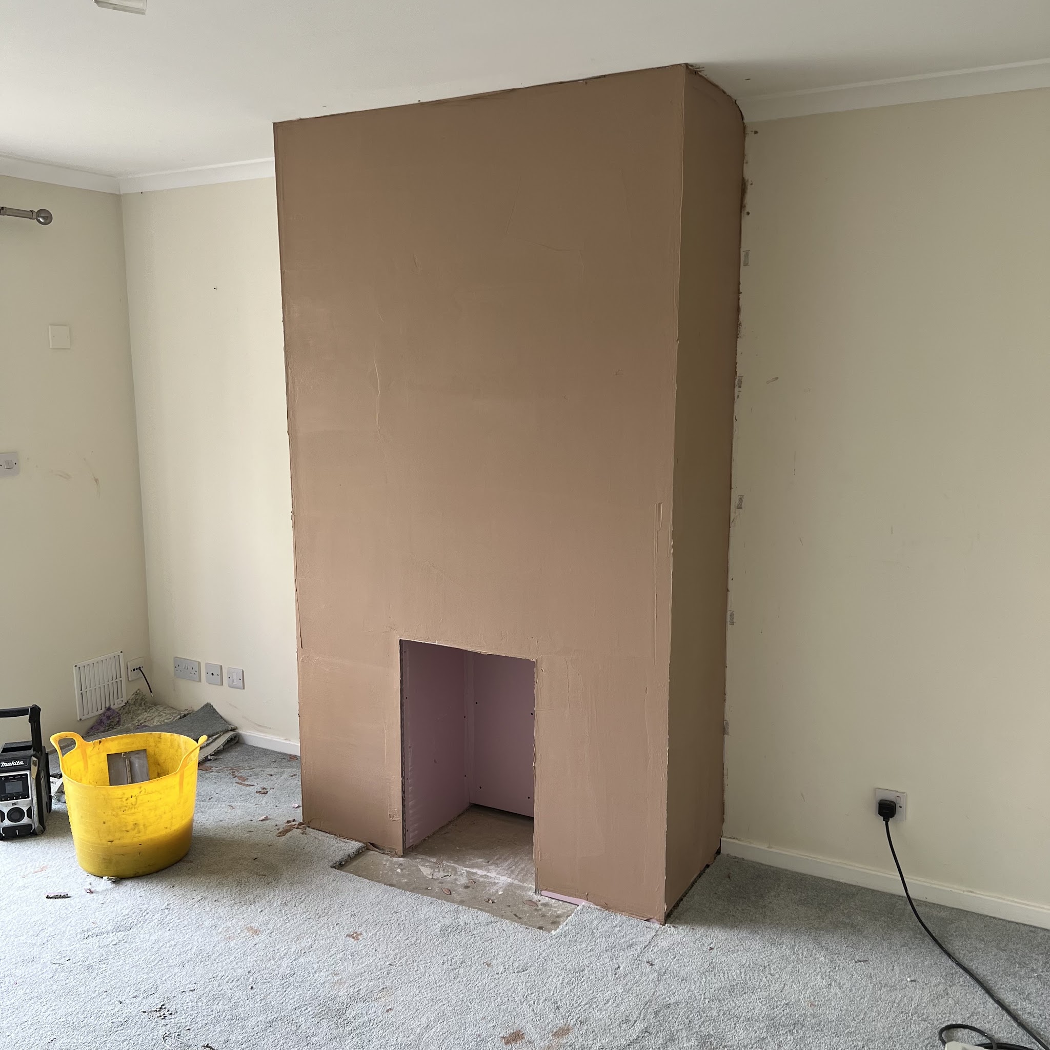 Chimney breast boarded out, before plastering