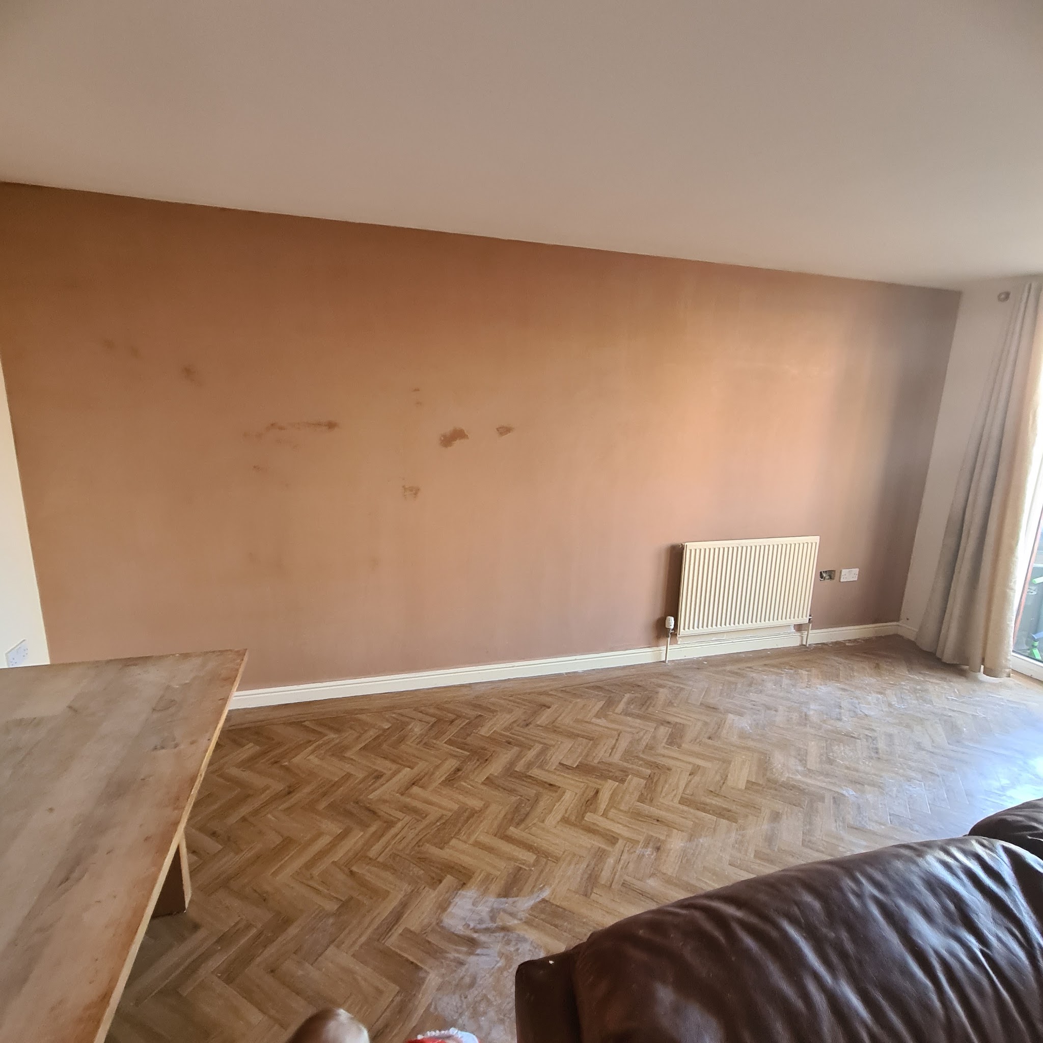 Living room wall freshly plastered