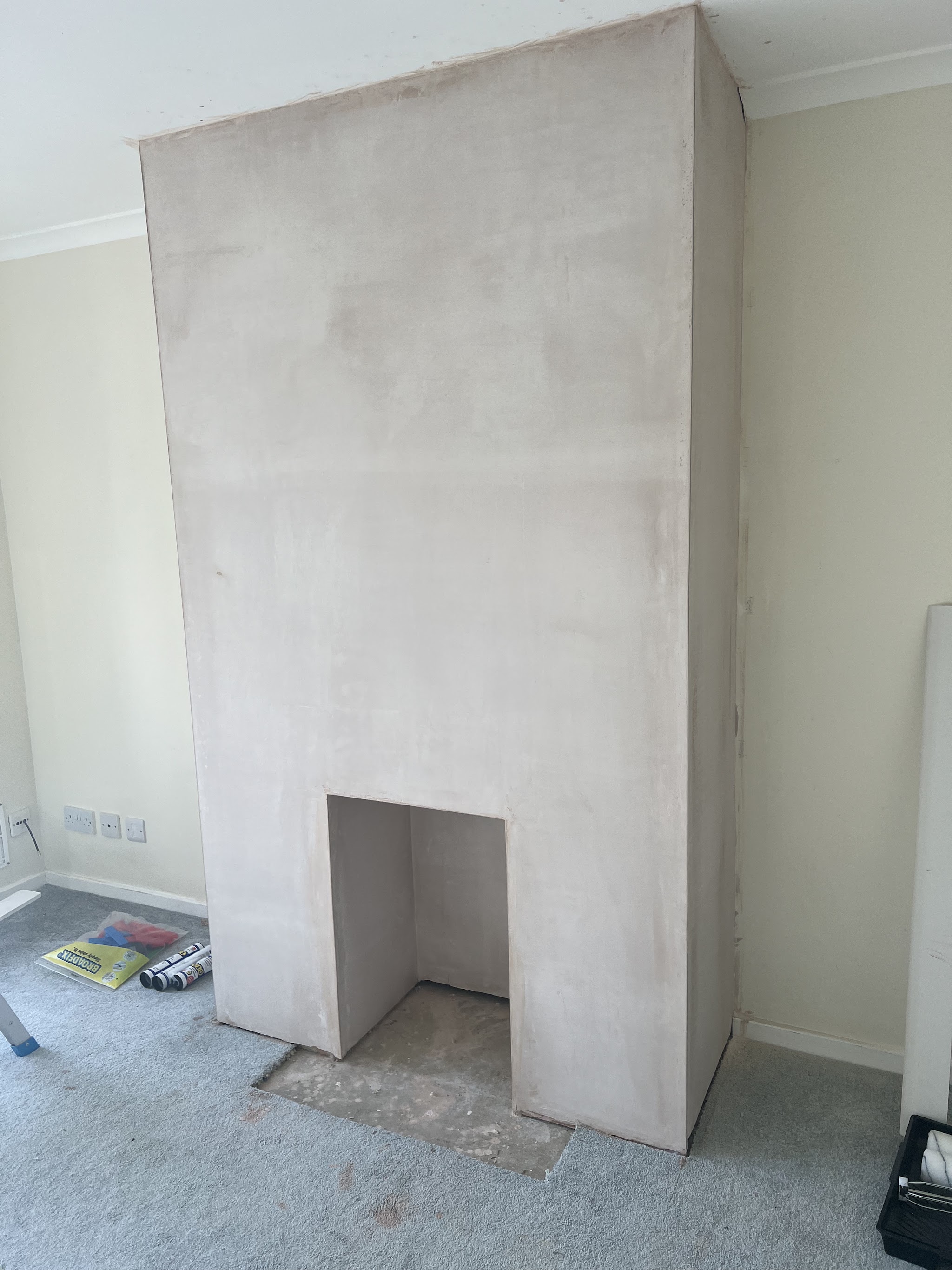 The same chimney breast skimmed smooth and drying
